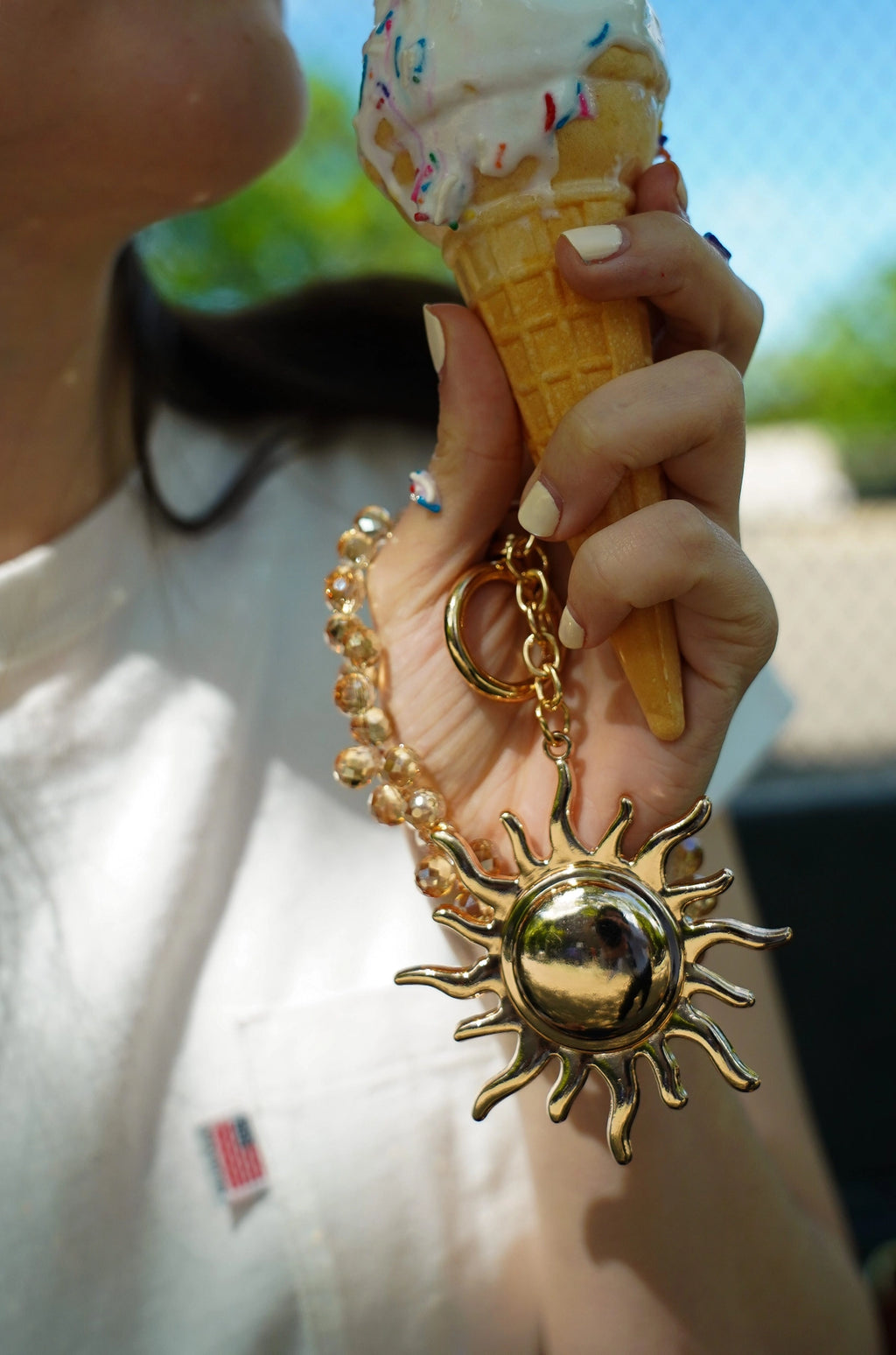 Gold Sun Hang-Off with Rhinestone Charm